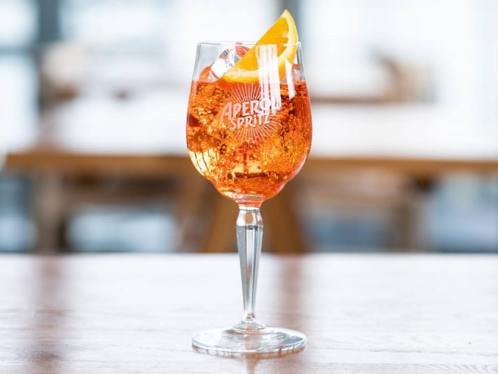 Aperol Spritz cocktail in a large wine glass